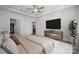 This main bedroom features neutral paint, a ceiling fan, and access to a walk-in closet for ample storage at 4010 Grace Pointe Dr, Indian Trail, NC 28079