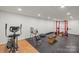 Basement workout room featuring state-of-the-art equipment for a comprehensive fitness experience at 4616 Gold Finch Dr, Denver, NC 28037