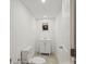 Efficient half bathroom featuring white cabinets and modern fixtures to optimize space at 4616 Gold Finch Dr, Denver, NC 28037