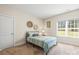 Cozy bedroom with a comfortable bed, natural light, and decorative wall art at 4616 Gold Finch Dr, Denver, NC 28037
