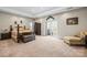 Bright bedroom with large closet, neutral carpet, and access to private balcony at 4616 Gold Finch Dr, Denver, NC 28037