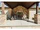 Charming front porch with stone columns and double doors, creating a warm and welcoming entrance at 4616 Gold Finch Dr, Denver, NC 28037