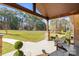 Spacious front porch with seating, offering a relaxing outdoor space overlooking the lush front yard at 4616 Gold Finch Dr, Denver, NC 28037