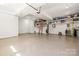 Large garage with high ceilings, shelving, and ample storage space at 4616 Gold Finch Dr, Denver, NC 28037
