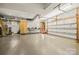 Spacious garage with ample storage and a large garage door at 4616 Gold Finch Dr, Denver, NC 28037
