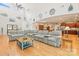 Open-concept living room with hardwood floors, high ceilings, and a comfortable sectional sofa at 4616 Gold Finch Dr, Denver, NC 28037