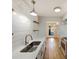 Updated kitchen featuring white cabinets, quartz countertops, shiplap walls, and stainless steel appliances at 4918 Sardis Rd # E, Charlotte, NC 28270