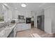 Well-lit kitchen featuring stainless steel appliances and stylish backsplash at 520 Mainsail Rd, Salisbury, NC 28146