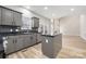 Modern kitchen with stainless steel appliances, granite countertops, and center island at 6529 Harburn Forest Dr, Charlotte, NC 28269