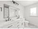 Bright bathroom features dual vanity, and a large mirror at 6535 Fisher Farm Nw Ln, Concord, NC 28027