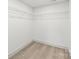 Functional walk-in closet with installed shelving provides ample storage space at 6535 Fisher Farm Nw Ln, Concord, NC 28027