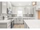 Modern kitchen featuring stainless steel appliances, granite countertops, shaker cabinets, and subway tile backsplash at 6535 Fisher Farm Nw Ln, Concord, NC 28027