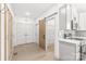 Modern kitchen with stainless steel appliances, a pantry, plenty of storage, and a rustic sliding barn door at 6535 Fisher Farm Nw Ln, Concord, NC 28027