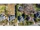Aerial view of a home with a backyard pool and surrounding landscape at 7205 Yellowhorn Trl, Waxhaw, NC 28173