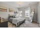 Cozy bedroom with a patterned rug and plenty of natural light at 7205 Yellowhorn Trl, Waxhaw, NC 28173