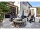 A stone fire pit is the focal point of this backyard patio at 7205 Yellowhorn Trl, Waxhaw, NC 28173