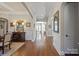 Inviting foyer with hardwood floors, arched doorways, and elegant decor at 7205 Yellowhorn Trl, Waxhaw, NC 28173