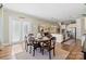 Bright dining area next to kitchen and living room, featuring a set table and plenty of natural light at 7205 Yellowhorn Trl, Waxhaw, NC 28173