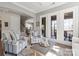 Inviting living room with hardwood floors, French doors, and comfortable seating area at 7205 Yellowhorn Trl, Waxhaw, NC 28173