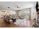 Bright living room featuring hardwood floors, comfortable seating, and natural light at 7205 Yellowhorn Trl, Waxhaw, NC 28173