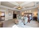 Bright main bedroom with tray ceiling and a cozy sitting area at 7205 Yellowhorn Trl, Waxhaw, NC 28173