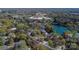 Picturesque aerial view of a neighborhood, nearby lake, shopping area, and lush surrounding landscape at 7214 Quail Meadow Ln, Charlotte, NC 28210