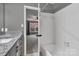 This bathroom boasts a granite-topped vanity and white tiled shower at 7214 Quail Meadow Ln, Charlotte, NC 28210