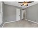 This bedroom boasts soft carpeting and calming gray walls at 7214 Quail Meadow Ln, Charlotte, NC 28210