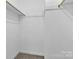 This walk-in closet offers neutral walls and carpeting at 7214 Quail Meadow Ln, Charlotte, NC 28210