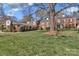 Exterior shot of house showing yard and brick facade at 7214 Quail Meadow Ln, Charlotte, NC 28210