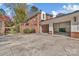 Brick home exterior featuring a private driveway and a two-car garage at 7214 Quail Meadow Ln, Charlotte, NC 28210