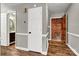 Hallway featuring hardwood floors and neutral paint at 7214 Quail Meadow Ln, Charlotte, NC 28210