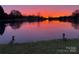 Scenic view of a lake at sunset at 7214 Quail Meadow Ln, Charlotte, NC 28210