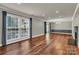 Spacious living room with hardwood floors, fireplace, and lots of light at 7214 Quail Meadow Ln, Charlotte, NC 28210