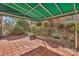 Charming outdoor patio area with a covered awning and beautifully landscaped surroundings at 7214 Quail Meadow Ln, Charlotte, NC 28210