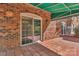 The outdoor patio features a brick exterior, glass sliding door, and ample sunlight at 7214 Quail Meadow Ln, Charlotte, NC 28210