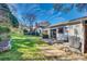 Spacious backyard with well-kept lawn, privacy hedges, and a small patio at 7532 Red Oak Ln, Charlotte, NC 28226