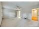 Large bedroom with carpet flooring, ceiling fan, and access to an ensuite bathroom at 7532 Red Oak Ln, Charlotte, NC 28226