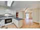 Bright kitchen with white cabinets, stainless steel appliances, and a breakfast bar at 7532 Red Oak Ln, Charlotte, NC 28226