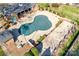 Aerial view of the gated community pool with cover, pool house, and patio at 7532 Red Oak Ln, Charlotte, NC 28226