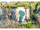 Aerial view of a community pool covered for the off-season, surrounded by meticulously kept green spaces at 7532 Red Oak Ln, Charlotte, NC 28226