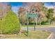 Carmel Hollow street sign on a lush green corner with a manicured landscape at 7532 Red Oak Ln, Charlotte, NC 28226