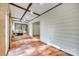Sunroom features terracotta tile flooring, white-washed paneled walls, and natural light, for serene relaxation at 7532 Red Oak Ln, Charlotte, NC 28226