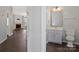 Clean, neutral bathroom with tile floor, vanity sink, and toilet creating a functional space at 8430 Forest Shadow Cir, Cornelius, NC 28031