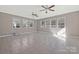 Large bonus room with ceramic tile floors and many windows at 8430 Forest Shadow Cir, Cornelius, NC 28031