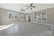 Bonus room features ceramic tile floors, many windows, and access to backyard at 8430 Forest Shadow Cir, Cornelius, NC 28031