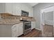 Well-appointed kitchen with stainless steel appliances and granite countertops at 8430 Forest Shadow Cir, Cornelius, NC 28031