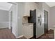 Galley kitchen features ample storage and stainless steel refrigerator at 8430 Forest Shadow Cir, Cornelius, NC 28031