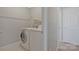 Laundry room has white washer, dryer, and storage to streamline household tasks at 8430 Forest Shadow Cir, Cornelius, NC 28031