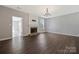 Spacious living room with a cozy fireplace and hardwood floors at 8430 Forest Shadow Cir, Cornelius, NC 28031